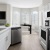 a kitchen with white cabinets